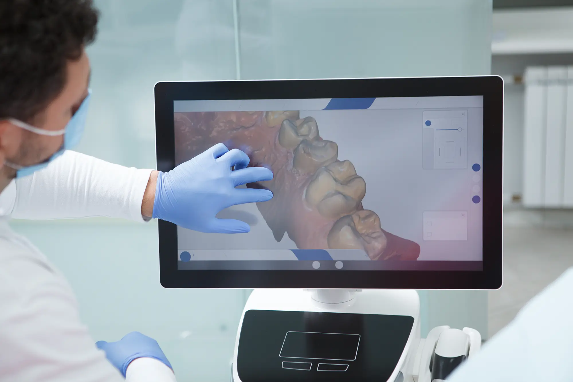 Dentist explaining Digital Dental X Ray from a display. Chaney Family Dental. Vallejo CA.